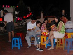 A Happy Family setting up Lanterns